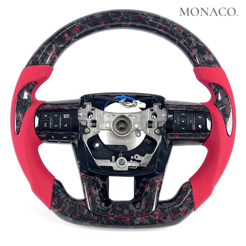 Custom carbon fiber steering wheel for Toyota Land Cruiser LC200 LC300 LC250 Prado Hilux (2008–2025): Red Perforated Leather Forged Carbon
