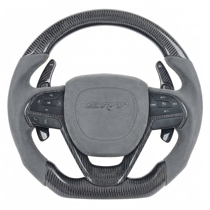 Steering wheel with a custom Alcantara airbag cover and badge