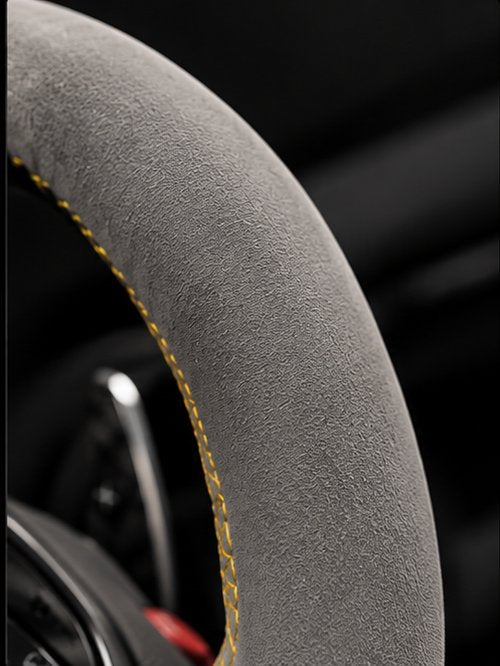 No carbon, full leather or Alcantara wrap on the wheel