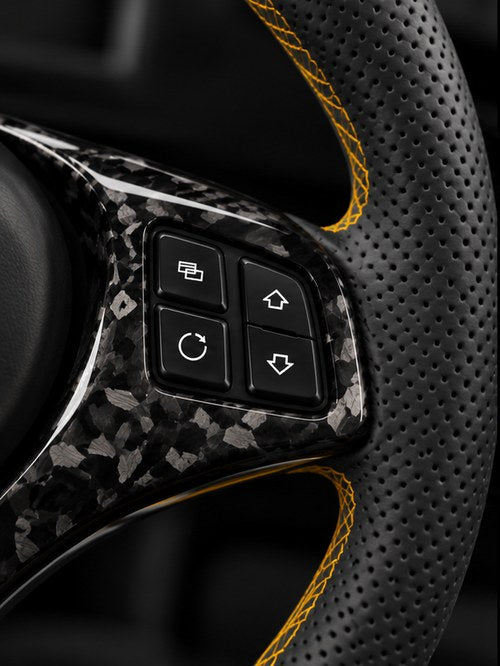 Perforated leather side upholstery on the wheel